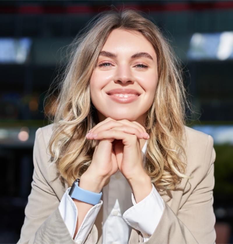 Woman in suit smiling