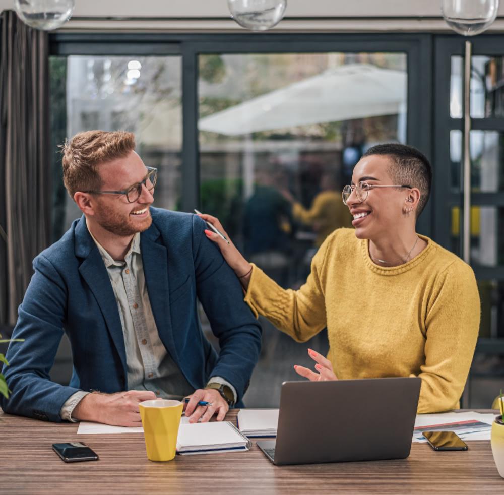 Business man giving a high-five to a business woman
